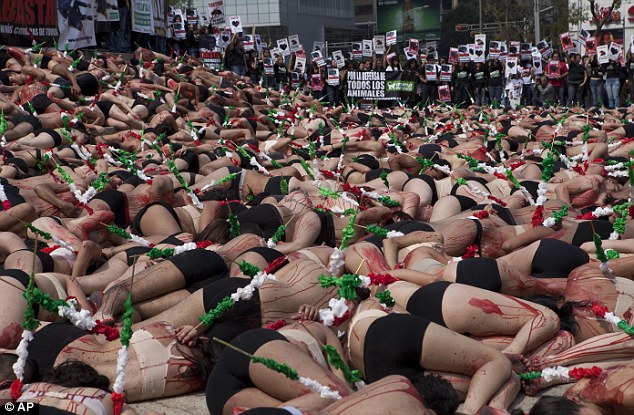 Hundreds of anti-bull fighting protestors stage a dramatic rally in Mexico City