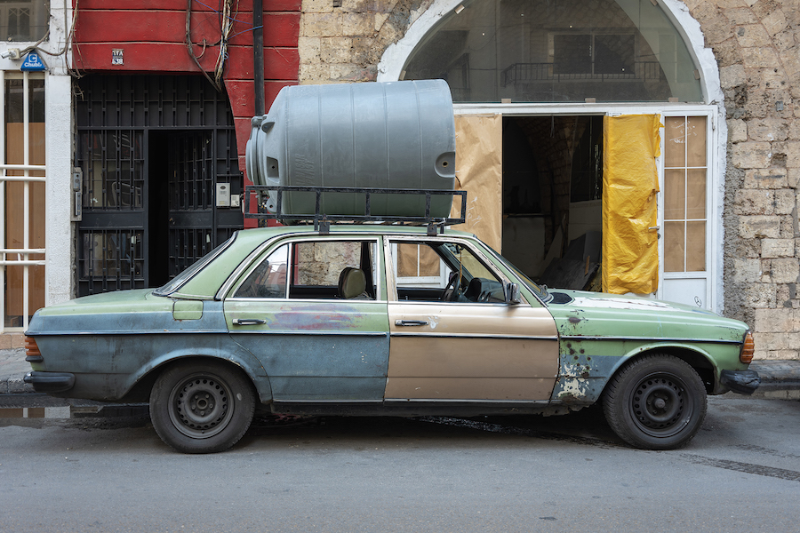 In Beirut, solar panels and water tanks tell a story of decline