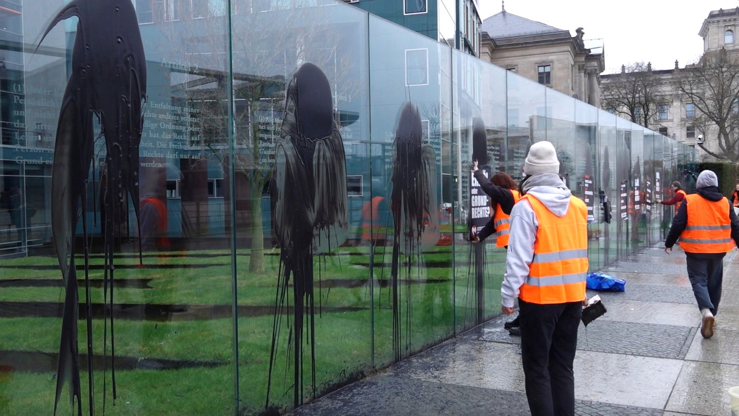 Climate Activists Deface Constitutional Monument in Germany with Black Paint, Posters