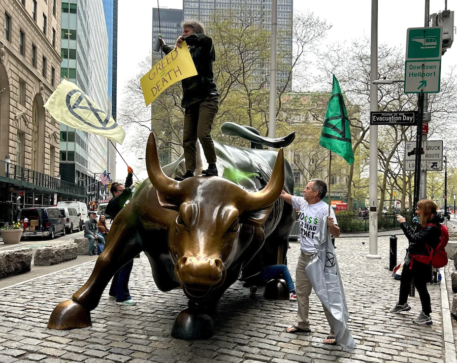 Climate Protesters Target NYC’s Iconic “Charging Bull” in Earth Day Protest