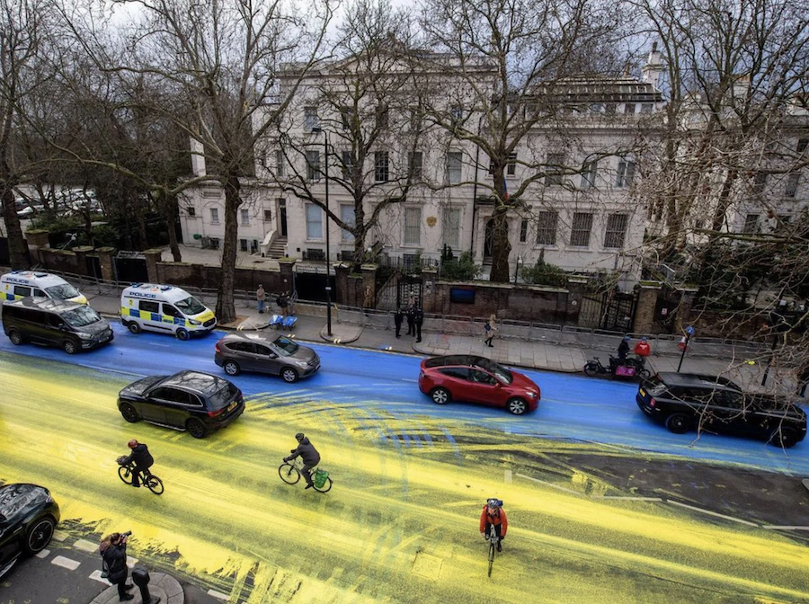 Art activist group Led by Donkeys paints Ukrainian flag in front of Russian embassy